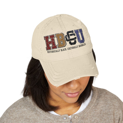 Creators Collection bone-colored distressed cotton cap with multicolor HBCU collegiate embroidery on the front.